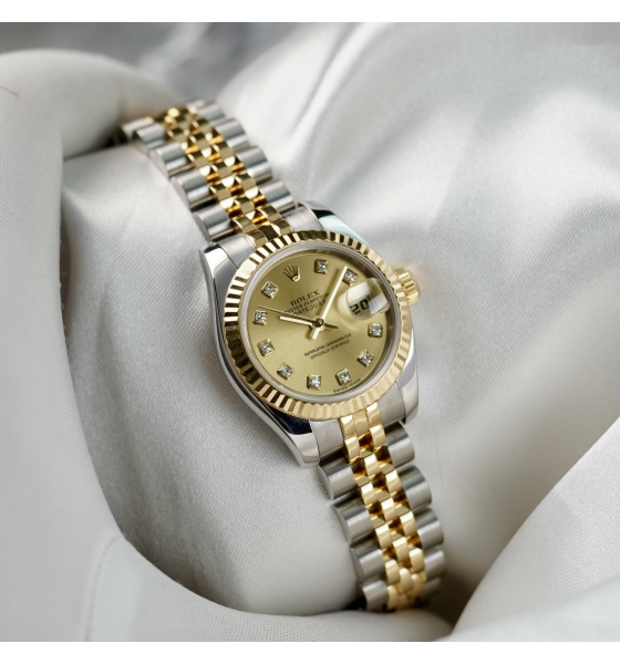 Đồng Hồ Rolex Nữ 179174 mặt vàng trải tia, cọc số kim cương